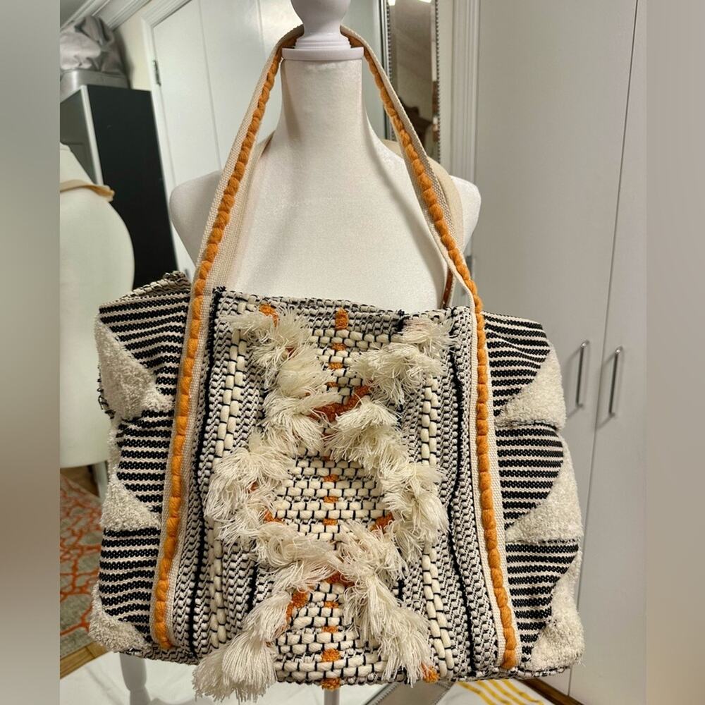 Woven cream, orange and black beach bag tote. Excellent condition.